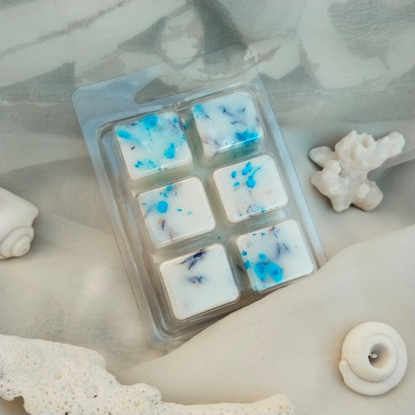 Clamshells de cera aromática de soja natural con aroma a brisa de mar, productos 100% naturales y ecológicos, vegano y cruelty-free. Producto artesano.